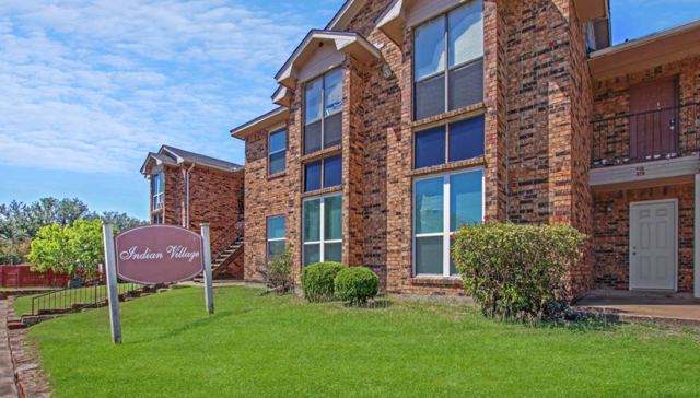 Indian Village brick apartment buildings with community sign