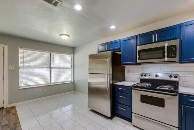 Living room open to the renovated kitchen