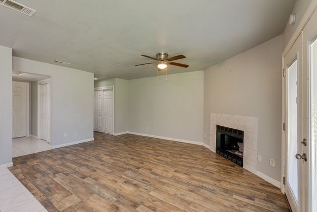 Living room with fireplace and French doors